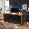 A modern home office setup with a wooden desk, computer, and decorative elements. Produktbild-Vorschau
