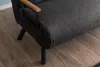 A close-up view of the side and seat of a dark gray sofa, with wooden armrests and black metal legs, resting on a wooden floor. Náhled obrázku produktu