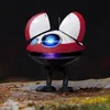 A small, red and white droid with blue glowing eyes stands on a rocky, mossy surface. Anteprima dell’immagine prodotto
