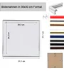 A diagram showing the dimensions of a picture frame, along with various color options for the frame. Produktbild-Vorschau