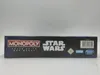 The side view of a Hasbro Star Wars Monopoly board game box. Produktbild-Vorschau