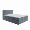A studio shot of a bed with a headboard, mattress, and base. Produktbild-Vorschau