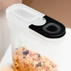 A close-up shot of a clear plastic food storage container filled with cereal. Produktbild-Vorschau