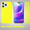 Multiple views of a bright yellow iPhone 14 Pro Max case, including the back, front screen with a colorful abstract wallpaper, and side views. The bottom view shows charging ports and speaker grilles. Produktbild-Vorschau