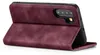A close-up, angled view of a burgundy flip-style phone case for a Huawei P30, shown open. Produktbild-Vorschau