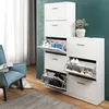 Two white shoe cabinets are shown in a room with a blue chair and a rug. Produktbild-Vorschau