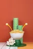 A whimsical arrangement of pasta and kitchen accessories, resembling a playful monster. Podgląd zdjęcia produktu