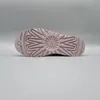 The image shows the sole of a pink UGG boot against a plain gray background. Produktbild-Vorschau