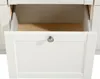 A close-up view of an open white drawer with a silver handle. Produktbild-Vorschau