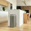 A modern kitchen with a trash can next to a marble island. Produktbild-Vorschau