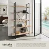 A modern living room with a bookshelf next to a swimming pool. Náhled obrázku produktu