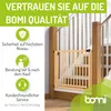A wooden baby gate installed on a staircase, with marketing text and icons on the left side. Produktbild-Vorschau