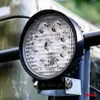 A close-up of a round LED work light mounted on a metal bracket. Anteprima dell’immagine prodotto