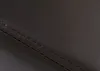 A close-up view of dark brown leather with visible stitching. Podgląd zdjęcia produktu