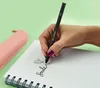 A hand writing in a notebook with a pen. Náhľad obrázku produktu