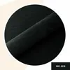 A close-up shot of black fabric, folded and displayed in a circle against a light background. Anteprima dell’immagine prodotto
