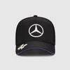 A black Mercedes-Benz F1 trucker cap with white and purple accents, shown against a light gray background. Produktbild-Vorschau