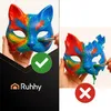 A split image showing a cat mask being painted. The left side shows a successful painting with a green checkmark and logo. The right side shows a damaged mask with a red cross. Náhled obrázku produktu