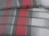 A close-up view of a plaid-patterned fabric, likely bedding, with stripes of red, gray, white, and black. Produktbild-Vorschau