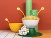 A whimsical arrangement of pasta serving utensils and ingredients, set against a vibrant backdrop. Podgląd zdjęcia produktu