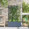 A balcony with a brick wall, a sink, a planter with climbing flowers, and a small shelf with gardening tools. Náhľad obrázku produktu