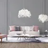 A modern living room with a sofa, coffee tables, and decorative lighting. Produktbild-Vorschau