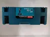 A teal plastic case for a power tool, with a label showing a picture of the tool and product information. Produktbild-Vorschau
