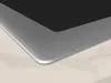 A close-up view of the corner of a black induction hob with a silver frame, resting on a light-colored surface. Podgląd zdjęcia produktu