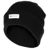 A black knitted beanie with a white label on the front.