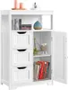 A white wooden cabinet with three drawers and a door that is open, revealing books and a decorative sheep. The top of the cabinet has candles and a cup. Produktbild-Vorschau