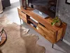 A modern living room with a wooden TV stand, a cowhide rug, and a coffee table. Produktbild-Vorschau