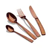 A set of four rose gold cutlery items arranged diagonally on a white background. Produktbild-Vorschau