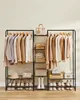 A clothing rack with various items of clothing and shoes neatly organized on shelves. Náhled obrázku produktu
