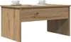 A wooden coffee table with two cups of coffee and a magazine on top, presented against a white background. Produktbild-Vorschau