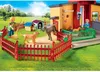 A Playmobil playset depicting a dog hotel with figures and dogs in an outdoor setting. Produktbild-Vorschau