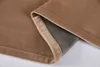 A close-up view of the folded edge of a sand-colored velvet curtain, showing the lining. Produktbild-Vorschau