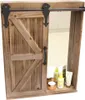 A wooden cabinet with a sliding barn door, containing shelves with toiletries. Náhled obrázku produktu