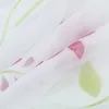 A close-up view of a white fabric with a floral pattern in pink and green. Produktbild-Vorschau
