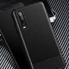 A close-up shot of a black carbon fiber phone case for a Huawei P30. Náhľad obrázku produktu