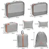 A collection of packing cubes and bags with dimensions indicated. Voir les images du produit