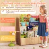A young girl is reaching for a book on a wooden children's bookshelf. The bookshelf is filled with various children's books. There are also graphic overlays highlighting product features. Podgląd zdjęcia produktu