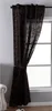 A brown patterned curtain is tied back with a tie-back and hangs next to a window.