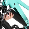 A hand is shown inserting a black battery pack into the frame of a teal electric bicycle. Produktbild-Vorschau