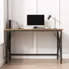 A computer desk with a monitor, keyboard, and lamp. Podgląd zdjęcia produktu