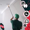 A painter is using a telescopic pole with a paint roller to paint a ceiling. There are several icons on the right side of the image, and a logo on the bottom left. Produktbild-Vorschau