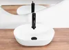 A white oval vessel sink with a black faucet is shown on a wooden countertop, with a mirror reflecting the sink and faucet. Náhled obrázku produktu