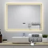 A modern bathroom sink with a large LED mirror above it, featuring a digital clock and control panel. Produktbild-Vorschau
