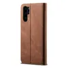 A brown leather flip case for a smartphone is shown against a white background. Produktbild-Vorschau