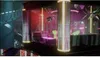 A futuristic, neon-lit interior with a disco ball and glowing pillars. Podgląd zdjęcia produktu