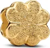 A close-up, studio shot of a gold-colored charm. Podgląd zdjęcia produktu